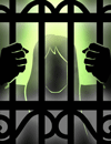 A woman behind bars.