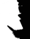 A shadowy person with a knife.