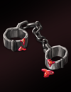 A set of shackled stained with red liquid.
